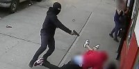 A masked gunman chased down a 24-year-old man and shoot him several times, barely missing two children in New York on May 17, 2021.