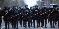 Minneapolis police officers stand in line during a protest in Brooklyn Center, Minneapolis, Minn., on April 11,2021.