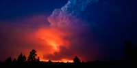 Image: Flames and smoke rise from the Bootleg fire in southern Oregon on July 14, 2021.