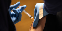 An immigrant receives a Covid-19 vaccination on March 14, 2021, in Stamford, Conn.