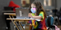 Christina Pagan, 7, does her school work at the Mulberry Street location of the Olivet Boys and Girls Club in Reading, Pa., on Jan. 19, 2021.