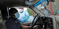 Image: Medical workers with Delta Health Center prepare to vaccinate people at a pop-up Covid-19 vaccination clinic in Leland, Miss., a rural Delta community, on April 29, 2021.