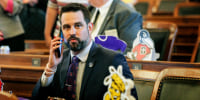 Kansas state Rep. Mark Samsel, R-Wellsville, talks on his cellphone ahead of the House's daily session, at the Statehouse in Topeka, Kan., on May 3, 2021.