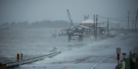 Storm surge begins to encroach on Louisiana Route 1 ahead of Hurricane Ida in Golden Meadow, La., on Aug. 29, 2021.