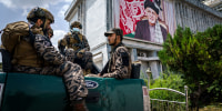 Taliban fighters patrol around the civilian terminal of the Hamid Karzai International Airport, after the full U.S. military withdrawal from the country, in Kabul, Afghanistan on Aug. 31, 2021.