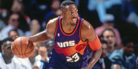 Cedric Ceballos #23 of the Phoenix Suns dribbles the ball during the game against the Dallas Mavericks in 1994 in Dallas.