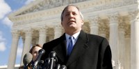 FILE PHOTO: Texas Attorney General Ken Paxton addresses reporters on the steps of the U.S. Supreme Court in Washington