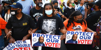 Protesters rally to demand protection for voting rights on the 58th anniversary of the 1963 March on Washington on Aug. 28, 2021, in Washington.