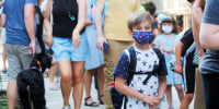 A child wears a face mask on the first day of school in Brooklyn, N.Y., on Sept. 13, 2021.