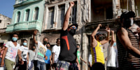 Image: People shout slogans during a demonstration in Havana on July 11, 2021.