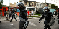 Riot police walk the streets after an antigovernmental demonstration in Havana on July 12, 2021.