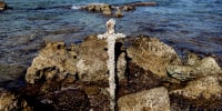 A sword believed to have belonged to a Crusader who sailed to the Holy Land almost a millennium ago was found in Caesarea