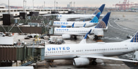 United Airlines planes sit on the runway at Newark Liberty International Airport on Nov. 30, 2021, in Newark, N.J.