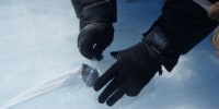 Collecting a meteorite on the Nansen blue ice area, close to the Belgian Antarctic research station Princess Elisabeth.