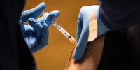 A health worker administers a dose of the Moderna Covid-19 vaccine in Stamford, Conn., on March 14, 2021.