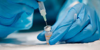 A nurse prepares the Pfizer-BioNTech Covid-19 vaccine in Montreal.