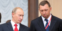 Image: Then Russian Prime Minister Vladimir Putin speaks with Oleg Deripaska at an investment forum in Sochi in 2008.