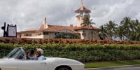 A car passes in front of former President Donald Trump's Mar-a-Lago resort on February 11, 2022 in Palm Beach, Fla.