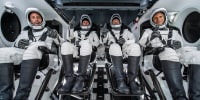 The Ax-1 crew inside SpaceX's Dragon capsule