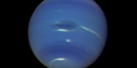 Image: Neptune's atmosphere, with The Great Dark Spot at the center,  captured by Voyager 2 in 2000.