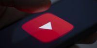 Image: YouTube logo on a smartphone.
