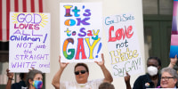 Demonstrators gather to speak on the steps of the Florida Historic Capitol Museum in front of the Florida State Capitol, in Tallahassee, Fla., on March 7, 2022.