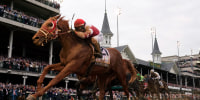 Rich Strike (21), with Sonny Leon aboard, wins the 148th running of the Kentucky Derby horse race at Churchill Downs on Saturday in Louisville, Kentucky.