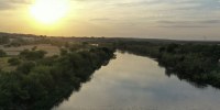 The Rio Grande flows between Mexico and Del Rio, Texas.