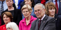 Senate Majority Leader Sen. Chuck Schumer, D-N.Y., and other Democratic senators listen during an event about the leaked Supreme Court draft decision to overturn Roe v. Wade on the steps of the Capitol on May 3, 2022.