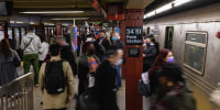People commute through the Penn Station