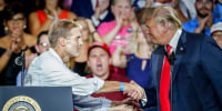 President Donald Trump, right, shakes hands with Rep. Jim Jordan, R-Ohio, left, during a rally, Aug. 4, 2018, in Lewis Center, Ohio.