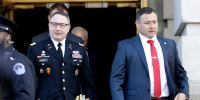 National Security Council aide Lt. Col. Alexander Vindman, at left, walks with his twin brother, Army Lt. Col. Yevgeny Vindman in Washington on Nov. 19, 2019.