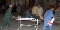 An injured man is transported to a hospital after a bombing in Mazar-e-Sharif, northern Afghanistan, Wednesday, on May 25, 2022.