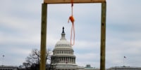 A noose is seen on makeshift gallows as supporters of President Donald Trump gather on the West side of the Capitol