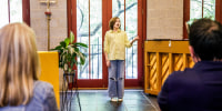 Diane and Mike Coppola watch their child, Michael, during a voice lesson at Trinity Lower East Side Lutheran Parish in New York on May 28, 2022.