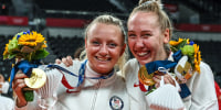 USA's Jordyn Poulter and Michelle Bartsch-Hackley pose with their gold medals during the women's volleyball victory ceremony during the Tokyo 2020 Olympic Games at Ariake Arena in Tokyo on Aug. 8, 2021.