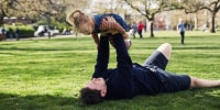 Father and daughter playing together in London park