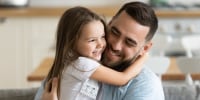 daughter hugging dad