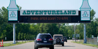 Visitors arrive at the Adventureland Park amusement park, on July 6, 2021, in Altoona, Iowa.