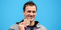Ryan Lochte stands on the podium during the medal ceremony for the Men's 200m Individual Medley final on Day 6 of the London 2012 Olympic Games on Aug. 2, 2012.