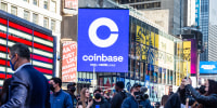 Monitors display Coinbase signage during the company's initial public offering at the Nasdaq MarketSite in New York on April 14, 2021.