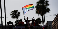 People celebrate during the Tampa Pride Parade on March 26, 2022 in Tampa, Fla.