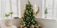 Image: A Christmas fir tree and holiday decor.