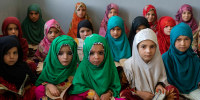 Afghan girls read the Quran in the Noor Mosque outside the city of Kabul on Aug 3, 2022.