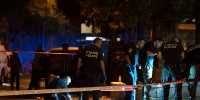 Israeli police crime scene investigators work at the scene of a shooting attack that wounded several Israelis near the Old City of Jerusalem, early Sunday, Aug. 14, 2022.