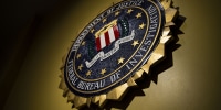Image: The seal of the Federal Bureau of Investigation hangs on a wall  at the FBI headquarters in Washington on June 14, 2018.
