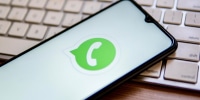 In this photo illustration, a WhatsApp logo seen displayed