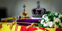 Image: The coffin of Queen Elizabeth II, draped in the Royal Standard with the Imperial State Crown and the Sovereign's orb and scepter, lying in state on the catafalque at Westminster Hall on Sept. 17, 2022 in London.