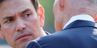Sen. Marco Rubio confers with Sen. Rick Scott outside the White House during a news conference September 15 in Washington, D.C.