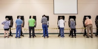 Voters cast ballots at a polling location at North Christian Church in Cheyenne, Wyo. on Aug. 16.